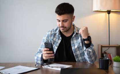 a man looking at a cellphone